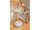 Elegant foyer with hardwood floors, a grand staircase, and a decorative medallion inlay at 19155 Lochmere Ct, Monument, CO 80132