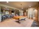 Spacious game room features a pool table, bar area, and ample seating at 19155 Lochmere Ct, Monument, CO 80132