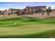 Picturesque view of a lush green golf course with a luxurious home in the background on a rolling hill at 19155 Lochmere Ct, Monument, CO 80132