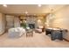Cozy living room with a stone fireplace, comfortable seating, and a game table at 19155 Lochmere Ct, Monument, CO 80132