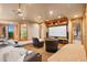 Home theater with tiered seating, a large projection screen, and comfortable leather chairs at 19155 Lochmere Ct, Monument, CO 80132