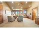 Bright office space featuring large windows, neutral decor, and a ceiling fan at 19155 Lochmere Ct, Monument, CO 80132