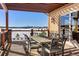 Covered patio dining area with scenic mountain views, ideal for outdoor entertaining at 19155 Lochmere Ct, Monument, CO 80132