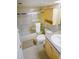 Bright bathroom with tiled floor, shower-tub combo, and vanity with storage at 6380 S Boston St # 191, Greenwood Village, CO 80111