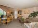 Relaxing common area with comfortable seating, tables, and natural light from the windows at 6380 S Boston St # 191, Greenwood Village, CO 80111