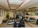 Well-lit gym with treadmills, weights, and mirrored wall for full visibility in a fitness center at 6380 S Boston St # 191, Greenwood Village, CO 80111