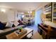 Comfortable living room with an attached dining area and view of the modern kitchen at 6380 S Boston St # 191, Greenwood Village, CO 80111