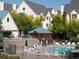 Inviting community pool area with a gazebo, lounge chairs, and mountain architecture in background at 6380 S Boston St # 191, Greenwood Village, CO 80111