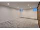 Finished basement with carpet and two small awning windows at 1571 Glencoe St, Denver, CO 80220