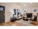 Bright living room with hardwood floors, fireplace, and comfortable seating at 1571 Glencoe St, Denver, CO 80220