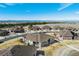 An aerial shot reveals the home's setting with easy access to local amenities and views of the distant mountains at 25019 E Alder Dr, Aurora, CO 80016