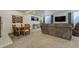 Basement featuring a dining area, entertainment center, and comfortable seating perfect for relaxation and gatherings at 25019 E Alder Dr, Aurora, CO 80016