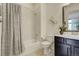 Bathroom featuring a tub, shower, toilet, and vanity with decorative elements creating a clean and functional space at 25019 E Alder Dr, Aurora, CO 80016