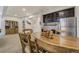 Beautiful dining area featuring a spacious table, ample lighting, and basement kitchenette at 25019 E Alder Dr, Aurora, CO 80016