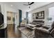 Bright living room featuring hardwood floors, a ceiling fan, and contemporary decor at 25019 E Alder Dr, Aurora, CO 80016