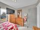 Spacious bedroom with furniture, TV and a mirror at 244 S Fetzer St, Byers, CO 80103