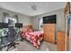 Comfortable bedroom with a TV, natural light, and room for a workspace at 244 S Fetzer St, Byers, CO 80103