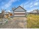 Exterior of detached two-car garage with multiple panels at 244 S Fetzer St, Byers, CO 80103