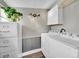 Well lit laundry room with washer, dryer and storage cabinet at 244 S Fetzer St, Byers, CO 80103