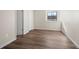 Bright bedroom featuring wood-look floors, a window, and closet at 1931 Centennial Dr # 1931, Louisville, CO 80027