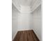 Walk-in closet with shelving and wood-look flooring at 1931 Centennial Dr # 1931, Louisville, CO 80027
