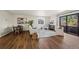 Sunlit living room with hardwood floors, stylish furnishings, and access to a private balcony at 1931 Centennial Dr # 1931, Louisville, CO 80027