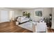 Bright living room with hardwood floors, comfortable seating, and natural light from a large window at 1931 Centennial Dr # 1931, Louisville, CO 80027