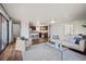 Open-concept living space featuring sleek flooring, neutral tones, and a modern glass coffee table at 1931 Centennial Dr # 1931, Louisville, CO 80027