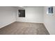Spacious basement bedroom with neutral carpeting and window at 4578 Malta St, Denver, CO 80249