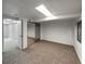 Bright bedroom featuring mirrored closet doors and carpet at 4578 Malta St, Denver, CO 80249