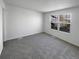 Spacious bedroom with window offering views and neutral carpet at 4578 Malta St, Denver, CO 80249