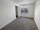 Well-lit bedroom with window, closet, and neutral carpeting at 4578 Malta St, Denver, CO 80249