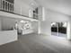 Bright living room featuring high ceilings and access to the backyard at 4578 Malta St, Denver, CO 80249