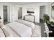 Main bedroom with a dresser and access to a bathroom and closet at 4578 Malta St, Denver, CO 80249
