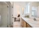 Bathroom features a glass shower stall and vanity with a view into an adjacent bedroom at 13093 W Cedar Dr # 121, Lakewood, CO 80228