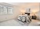Bright bedroom with ample natural light, neutral decor, and comfortable furnishings at 13093 W Cedar Dr # 121, Lakewood, CO 80228