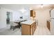 Dining area next to kitchen with a light fixture above the dining table and chairs at 13093 W Cedar Dr # 121, Lakewood, CO 80228