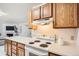 Functional kitchen featuring essential appliances and ample counter space, ideal for cooking at 13093 W Cedar Dr # 121, Lakewood, CO 80228
