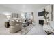 Bright living room featuring a fireplace, neutral furniture, and access to a balcony at 13093 W Cedar Dr # 121, Lakewood, CO 80228