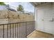 Enclosed patio with retaining wall provides privacy and access to storage at 13093 W Cedar Dr # 121, Lakewood, CO 80228