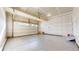 Spacious garage with high ceilings and epoxy flooring at 12915 E 102Nd Pl, Commerce City, CO 80022