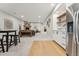 Finished basement with fireplace, seating area, wet bar, and stainless refrigerator at 1361 Art Dr, Berthoud, CO 80513