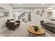 Spacious finished basement with a staircase, wet bar and multiple seating areas at 1361 Art Dr, Berthoud, CO 80513