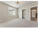 Carpeted bedroom with closet, large window, contemporary ceiling light, and neutral walls at 1361 Art Dr, Berthoud, CO 80513