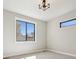 Bedroom with large windows providing natural light and scenic outdoor views at 1361 Art Dr, Berthoud, CO 80513