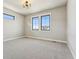 Spacious bedroom with large windows and ample natural light for a bright atmosphere at 1361 Art Dr, Berthoud, CO 80513