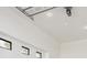 Clean and modern garage with bright lighting, white walls, and plenty of room for vehicles and storage at 1361 Art Dr, Berthoud, CO 80513