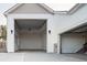 An open two-car garage offers interior access to the home in this modern house at 1361 Art Dr, Berthoud, CO 80513