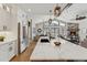 Open-concept kitchen featuring a large island, stainless steel appliances, and seamless flow to the living area at 1361 Art Dr, Berthoud, CO 80513