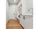 Mudroom boasting storage bench with built-in shelving for organized functionality at 1361 Art Dr, Berthoud, CO 80513